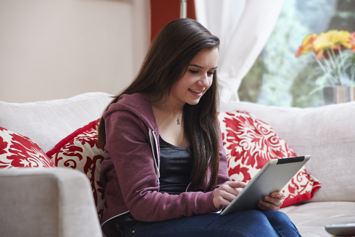 Teen girl using tablet