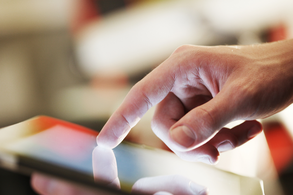 Close up of hands using a tablet computer