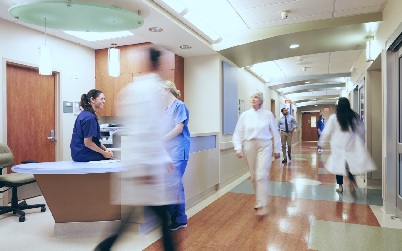 Busy hospital ward with staff working.