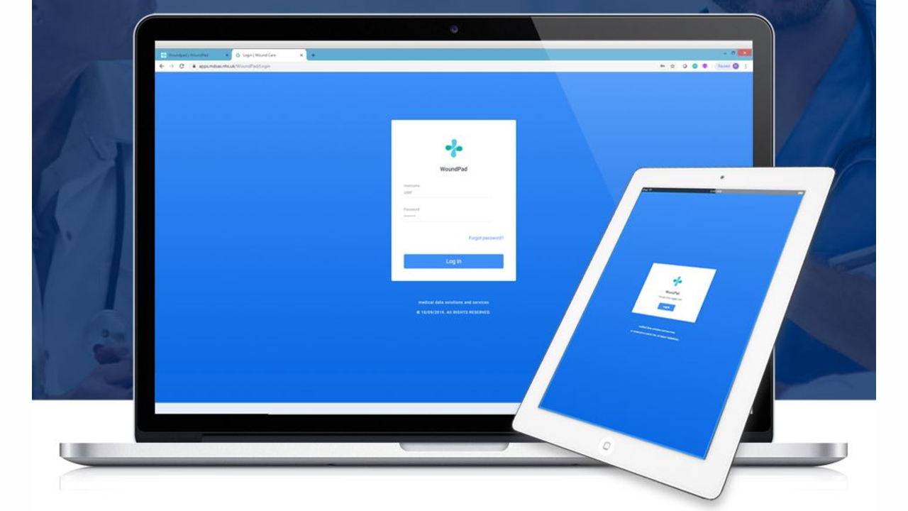 The WoundPad application, on two digital devices - one laptop & one tablet.