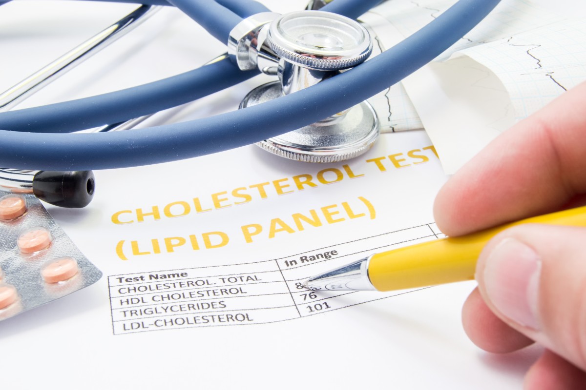 Medical professional reviewing cholesterol lipid panel results