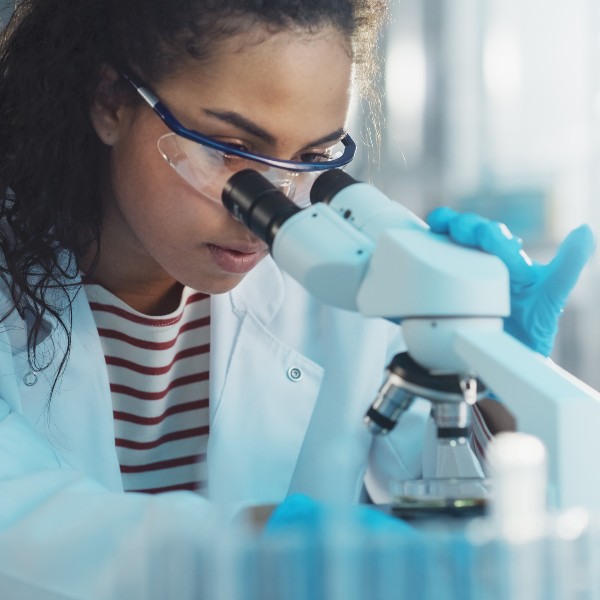 Researcher using laboratory equipment