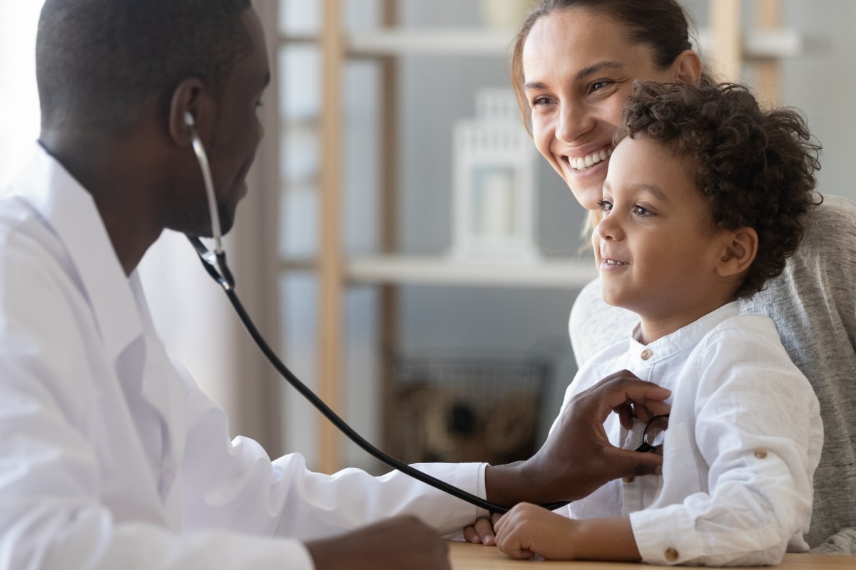 Child patient being monitored by doctor