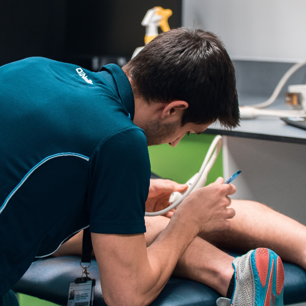 MMU IoS - student working on a patient.