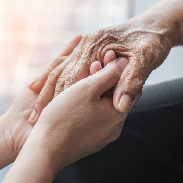 person's hand in support