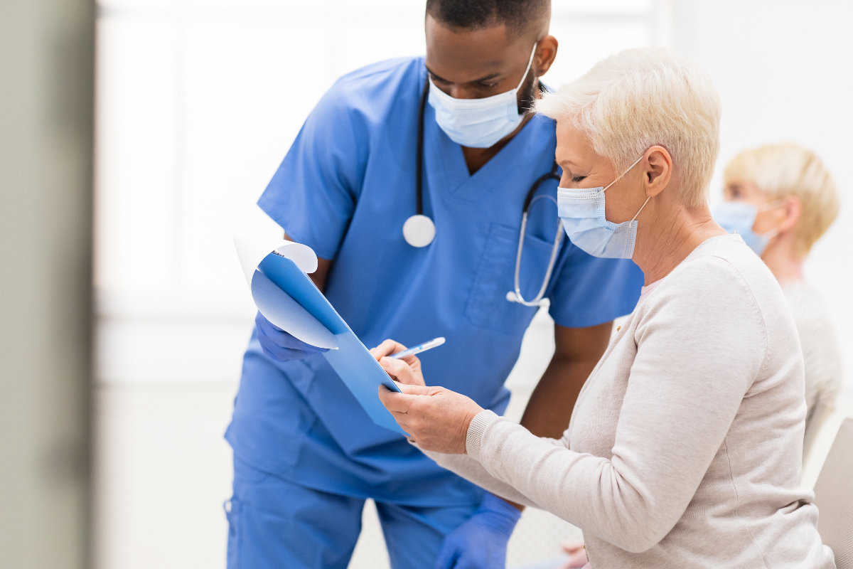 Nurse assisting a patient.