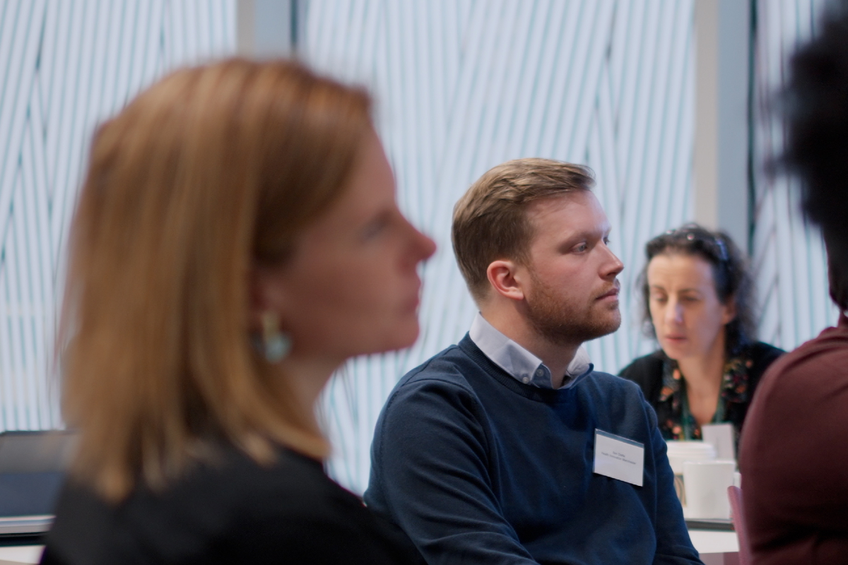 Colleagues listening to a presentation.
