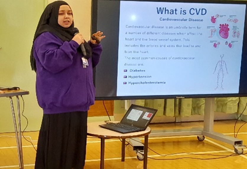 Sanya presents slides in both English and Urdu